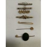 Four early 20th century bar brooches all in 9ct gold, variously set with seed pearls, aqua marine