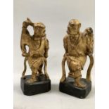 A pair of Chinese carved giltwood figures of warriors, standing, on ebonised plinths, 17.5cm high (