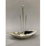 A WMF silver plated serving dish of boat shape with knopped carrying handle and double rings to