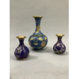 Cloisonne vase with slender neck and flared rim, the body of ovoid form decorated with foliage and