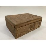 A pair of hardwood boxes, the panels carved with plant forms, leopard, fish, crocodile and other