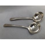A pair of George III silver cause ladles, leather edge pattern, each monogram with an image of