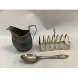 A George III silver cream jug helmet form with hammer pattern and open wreath cartouche,