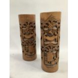 Pair of Chinese bamboo brush pots heavily carved with scenes depicting scenes of artisans and