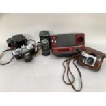 A quantity of vintage cameras including Praktica LTL in case, Contax in leather case, Pentacon