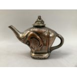 A silver plated on copper individual teapot moulded as an elephant, the associated lid with monkey
