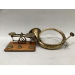 A brass hunting horn together with an Edward VII set of oak and brass postal scales (2)