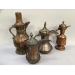 Four various Dallah copper coffee pots, various sizes from 41cm to 28cm
