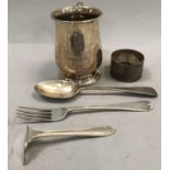 A George VI silver childs tankard, A/F, baluster shape over circular stepped foot with foliate S
