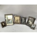 Six early 20th century silver fronted photograph frames (all at fault)
