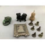 Seven various Indian brass seals, a vegetable ivory and bone tape measure and pin cushion in the
