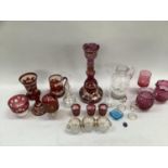 A collection of Victorian and later glass ware including ruby flash vase, mug, bottle, etched ruby