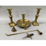 A brass chamber stick, pair of baluster candlesticks on rectangular bases, 18.5cm high, candle
