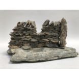 A slate model of a dry stone wall with stile, 29cm wide