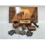 An wooden box, the top inlaid with map of Africa, bronze anchor, copper matchbox in the style of
