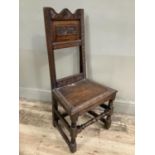 An 18th century and later panel back country chair on turned and square framing