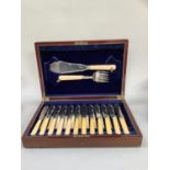 A mahogany canteen of silver plated fish knives and forks and pair of servers, 12 places