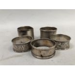 Five early to mid 20th century silver napkin rings