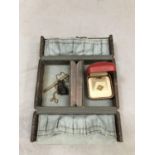 A mid 20th century jewellery case in reptile grain leather containing a George V neckchain in 9ct