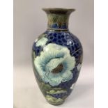A LATE 19TH CENTURY BURMANTOFTS FAIENCE VASE, incised and tube-lined with papaver in shades of