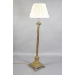 A BRASS CORINTHIAN COLUMN STANDARD LAMP, early 20th century, with telescopic height adjustment, on