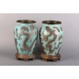 A PAIR OF WMF IKORA VERDIGRIS ENAMELLED AND GILT METAL VASES, ovoid, etched with sinuous dragons