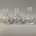 THREE VICTORIAN GLASS SPIRIT MEASURES, of globe form, two with slice cut necks and one etched with a