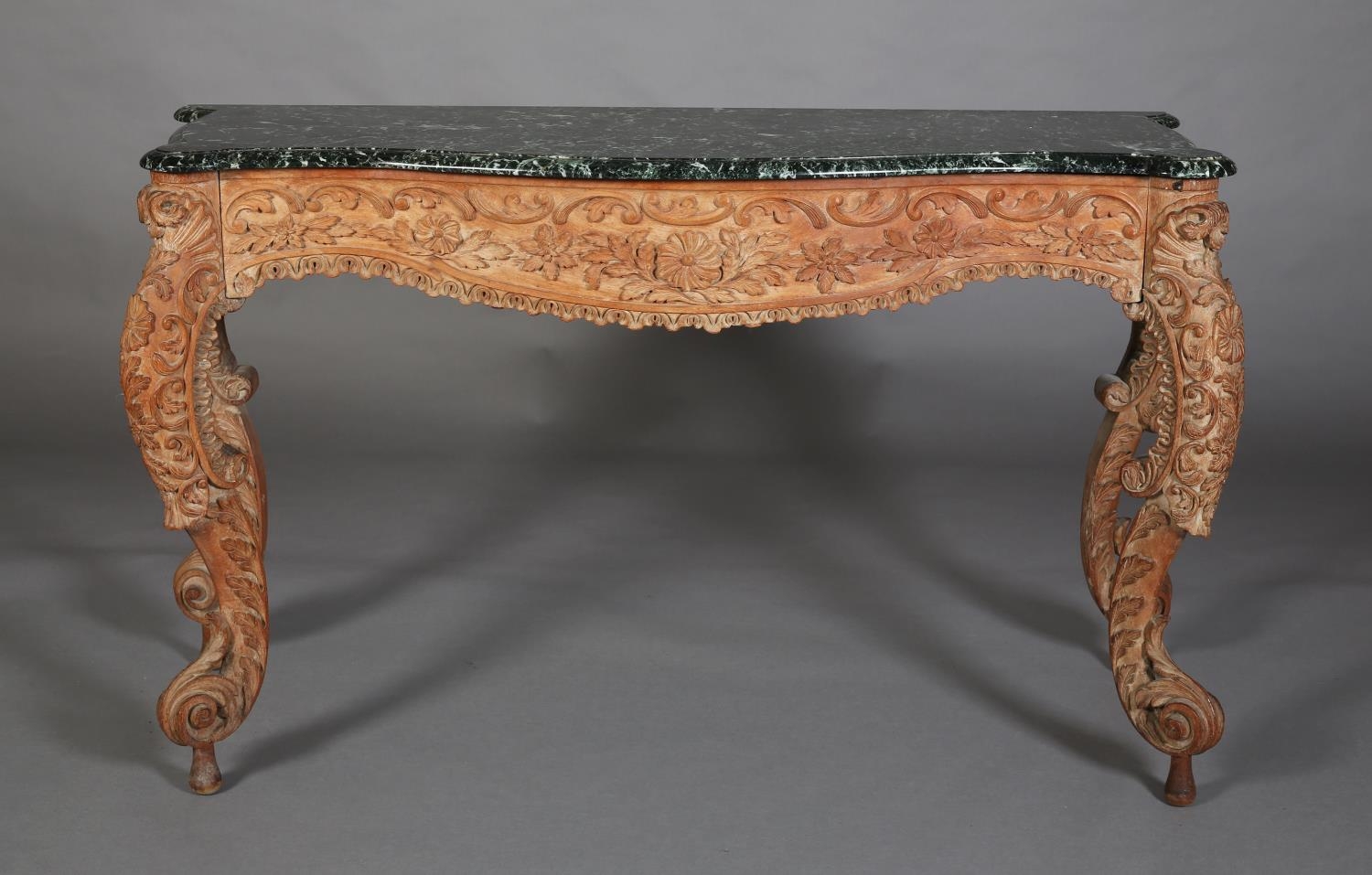 A 19TH CENTURY CARVED PINE AND GREEN MARBLE CONSOLE TABLE, of serpentine outline and apron, all over