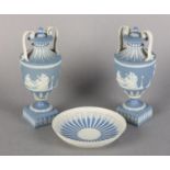 A PAIR OF EARLY 19TH CENTURY WEDGWOOD JASPERWARE URNS AND COVERS, the pale blue baluster body