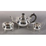 A GEORGE V THREE PIECE SILVER TEA SERVICE, London 1917, Charles Boyton & Sons, of circular form with