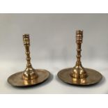 A PAIR OF LATE 16TH/17TH COPPER ALLOY SOCKET CANDLESTICKS, the knopped stem on a domed and broad