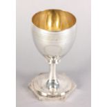 A GEORGE III SILVER CHALICE with gilded interior engraved with vacant cartouche on a hexagonal