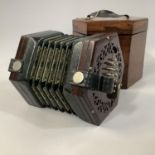 A19TH CENTURY ROSEWOOD CONCERTINA, fret carved hexagonal end boards 48 keys with leather bellows, in