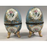 A PAIR OF FRENCH PORCELAIN CASKETS, ovoid decorated in the Sevres style, with floral and gilt