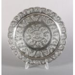 AN EARLY TO MID 20TH CENTURY MALAYSIAN SILVER TRAY chased and embossed to the centre with the