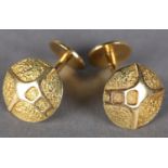 A PAIR OF CUFFLINKS IN 18CT GOLD c.1973, the circular faces with polished and textured abstract