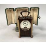 AN EARLY 20TH CENTURY FRENCH TRAVEL CLOCK with 8 day jewelled lever movement, the enamel dial with