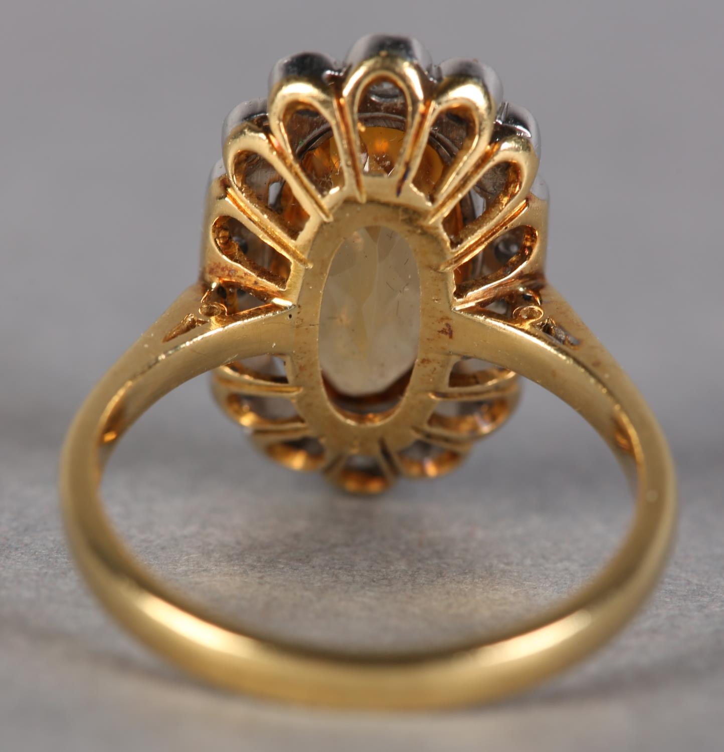 A TOPAZ AND DIAMOND CLUSTER RING in 18ct yellow and white gold, collet set to the centre with an - Image 3 of 3