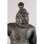 A JAPANESE BRONZED FIGURE OF BISHAMONTEH, standing in full armour holding a pagoda in his hand,