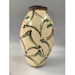 A LATE 19TH DANISH ART POTTERY VASE by Herman Kahler, the ovoid cream slip body painted with lozenge