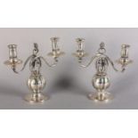 A MATCHED PAIR OF DANISH SILVER CANDELABRA each of two lights, pomegranate pattern in the manner