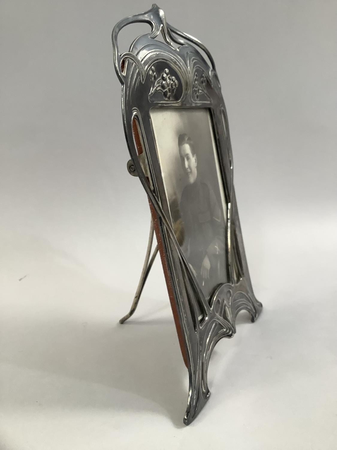 AN ART NOUVEAU SILVER PLATED PHOTOGRAPH FRAME BY WMF, of arched rectangular outline, cast with plant - Image 6 of 8