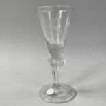 AN 18TH CENTURY WINE GLASS the trumpet bowl etched with a stag, on a solid collar and Silesian stem,
