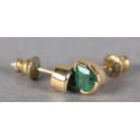 A PAIR OF EMERALD EARRINGS, each pear shaped faceted stone, collet set in yellow metal (tests as