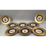 A SET OF EIGHT HUTSCHENREUTHER PLATES, the centres painted with floral sprays within a band of