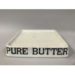 A GROCER'S POTTERY BUTTER SLAB, lettered in black 'Pure Butter', 35cm square, by Parnall & Sons, The