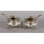 A PAIR OF VICTORIAN SILVER SALTS each of baluster form scroll engraved and chased with open