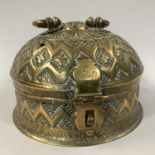 A LATE 19TH CENTURY INDIAN BRASS BETEL NUT PANDAN BOX, circular with domed cover and twisted