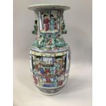 A 19TH CENTURY CHINESE FAMILLE ROSE VASE, the ovoid body painted with panels of dignitaries on