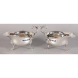 A PAIR OF ELIZABETH II SILVER SAUCE BOATS, Sheffield 1989 for C J Vanden Ltd, leaf capped scroll